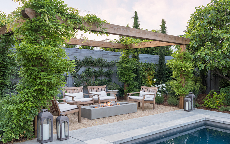 outdoor living space with arbor and pool