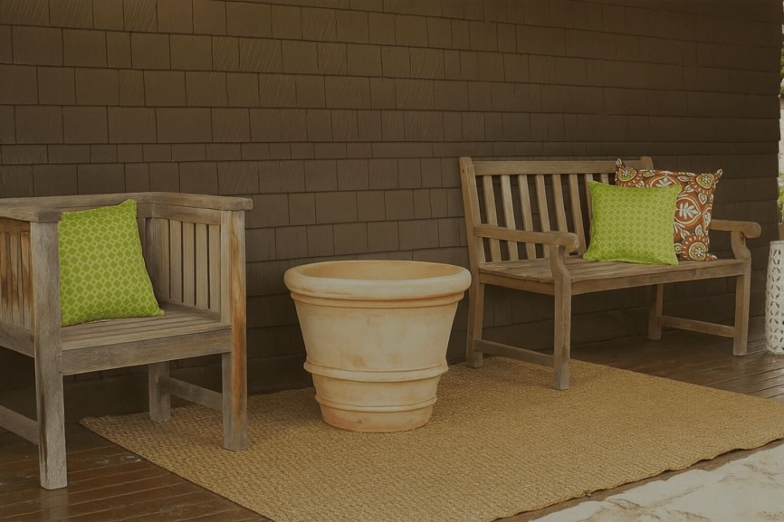 Two chairs with a garden container in between with text that reads, "How to create No-Fuss, All-Season Containers."