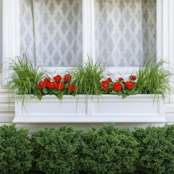 White window box with dwarf grasses and colorful annuals and text that reads, "Easy Breezy Color."