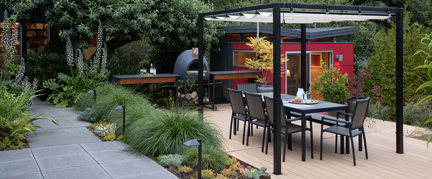outdoor dining and pizza kitchen with red work shed